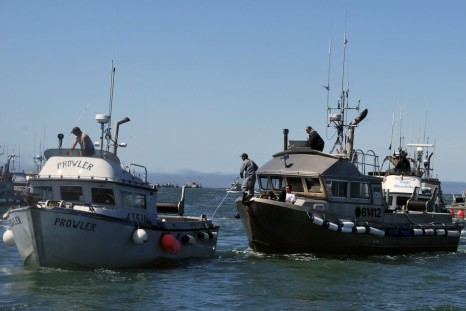 July 4, 2009 photo, drift gillnet fishing vessels line up near Egegik, Alaska,